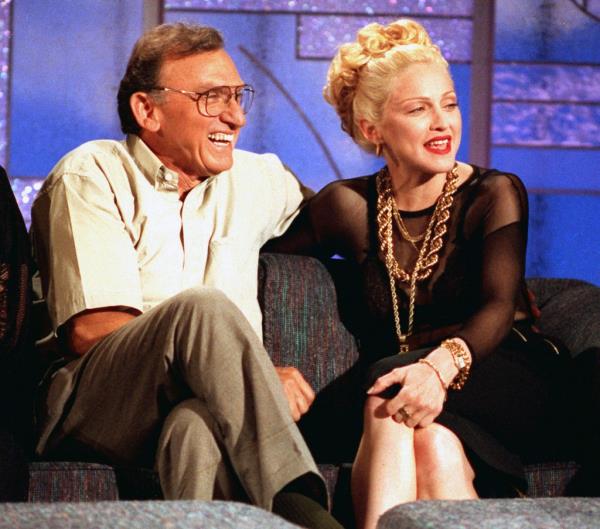 Madonna and her father, Silvio Anthony "Tony" Ciccone, laugh as they talk with Arsenio Hall during taping of Hall's talk show in Los Angeles on Jun. 15, 1992.